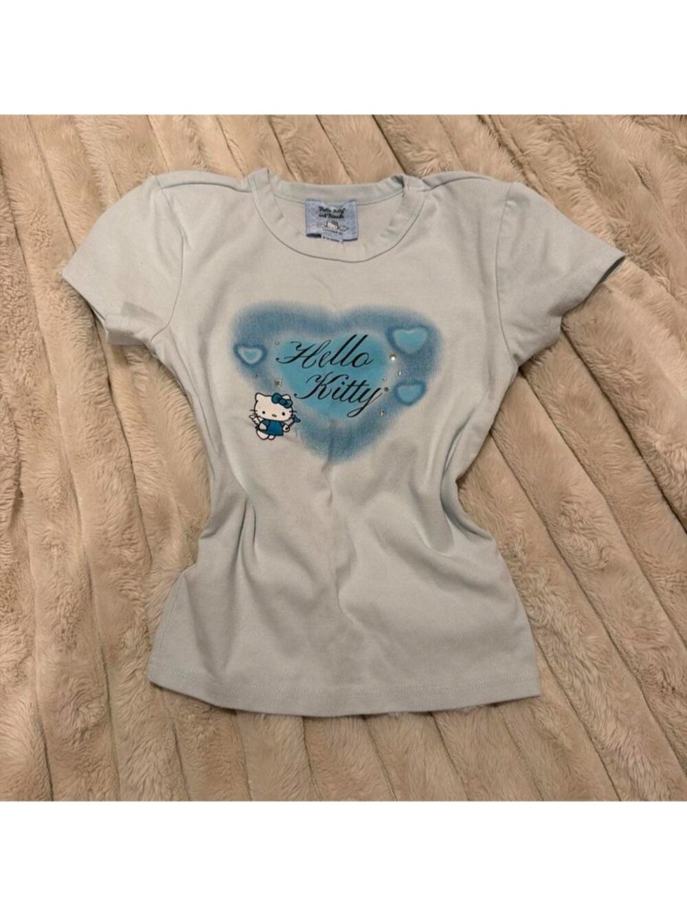 Sanrio Hello Kitty baby tee with blue heart graphic and Hello Kitty character